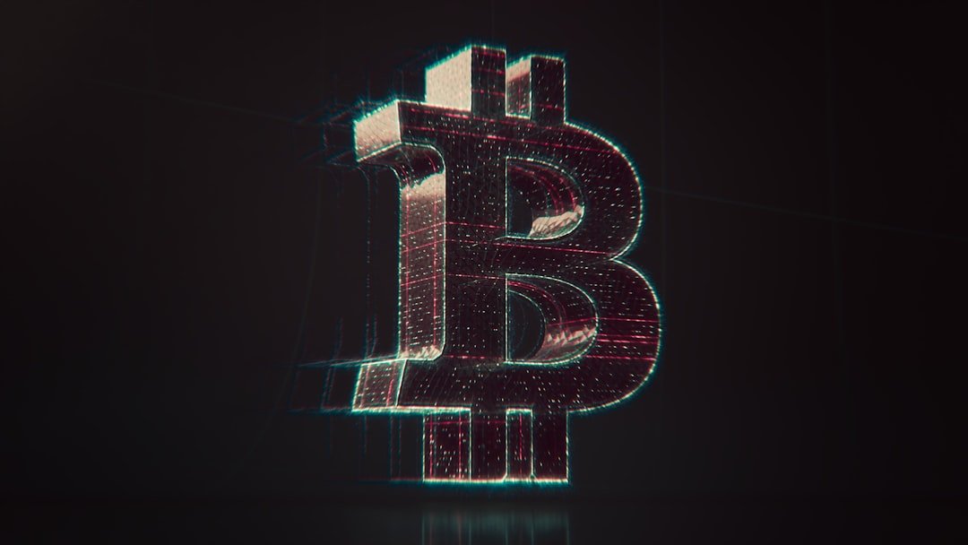 A shiny bitcoin logo on a black background