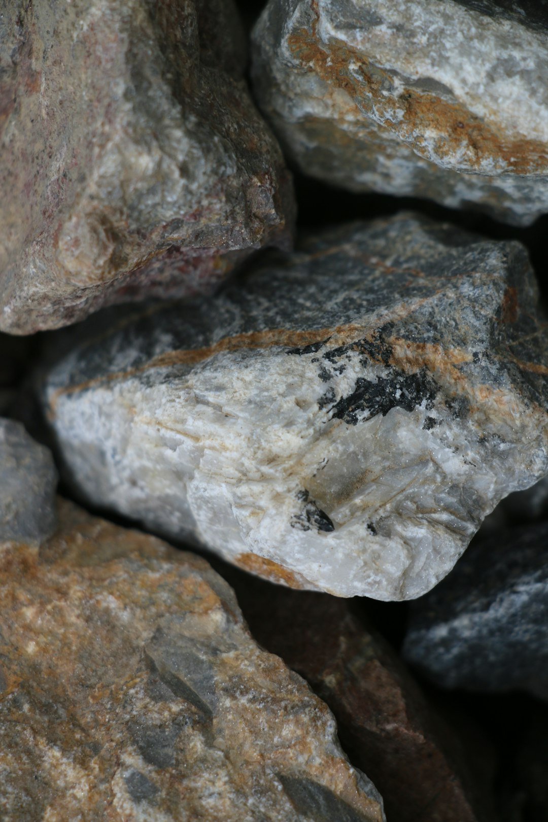 Close-up of a pile of different colored rocks.