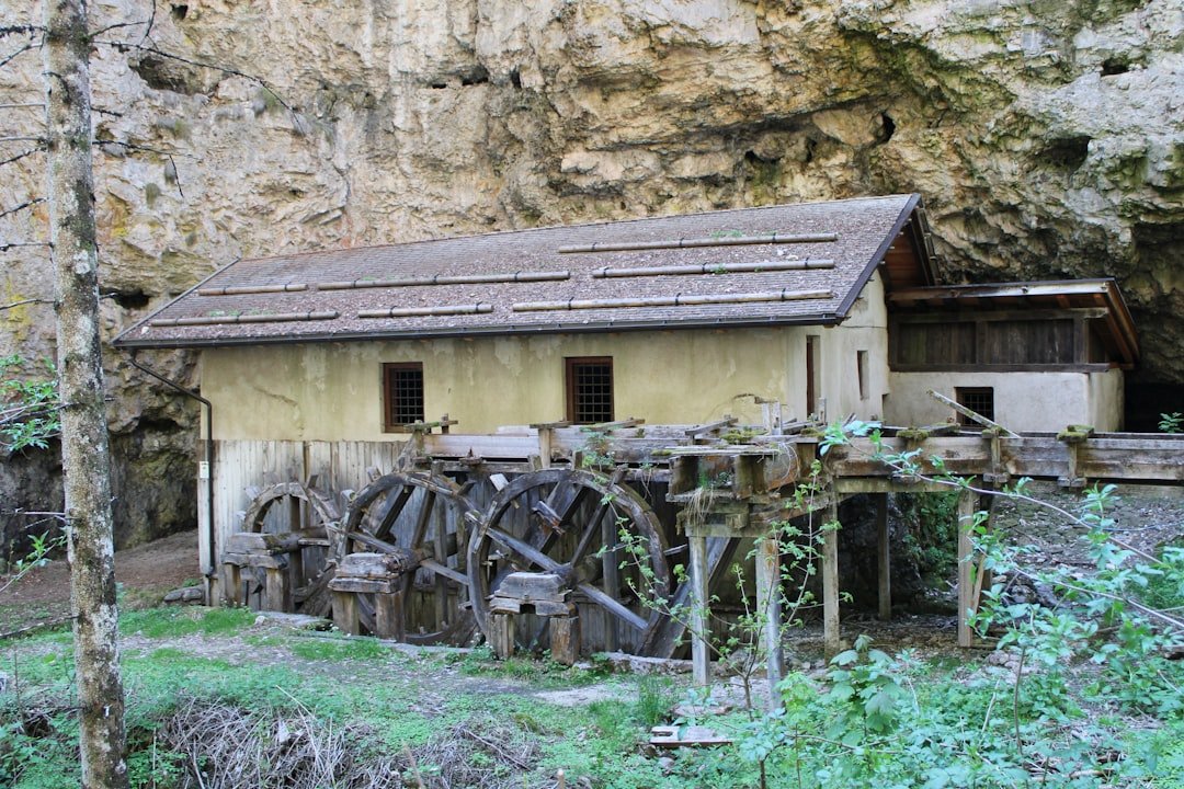 a building with a wheelbarrow in front of it