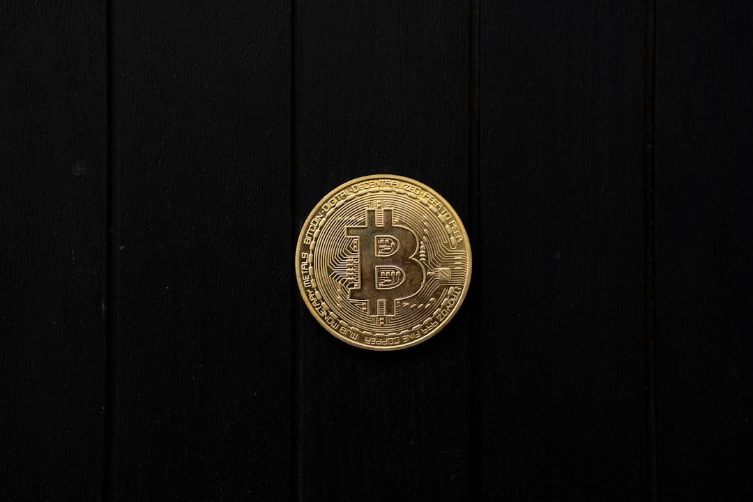 Bitcoin coin isolated on a black background.