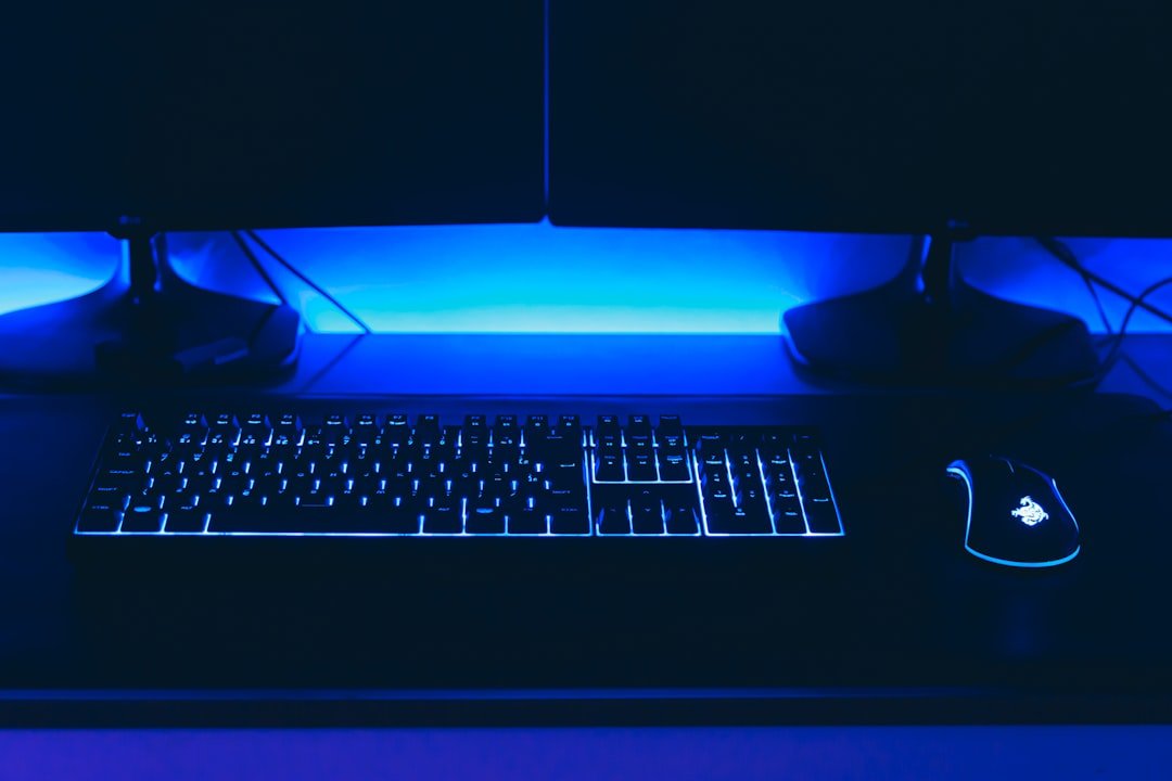 a computer desk with a keyboard and mouse
