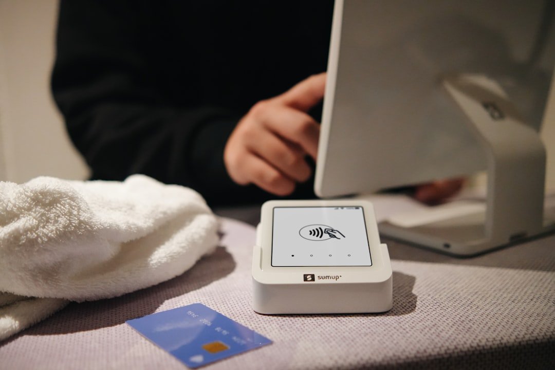 Person paying at a store with credit card.