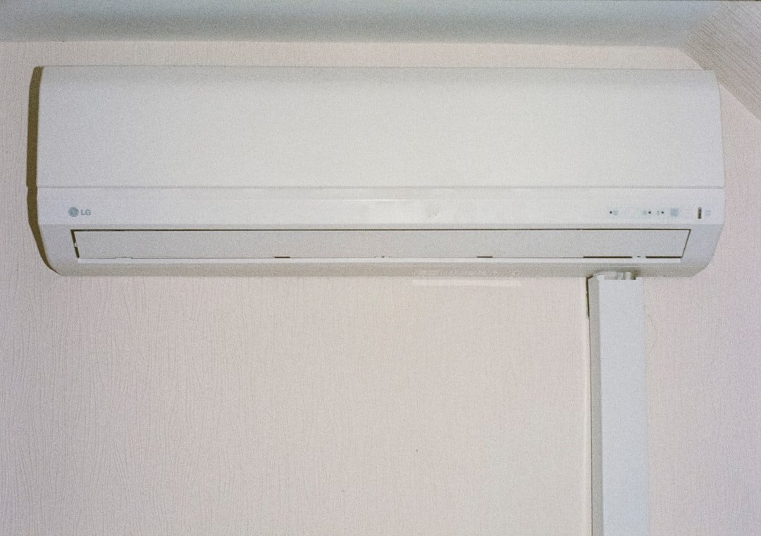 A white air conditioner mounted on a wall.