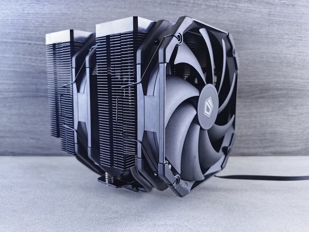 A close up of a computer fan on a table