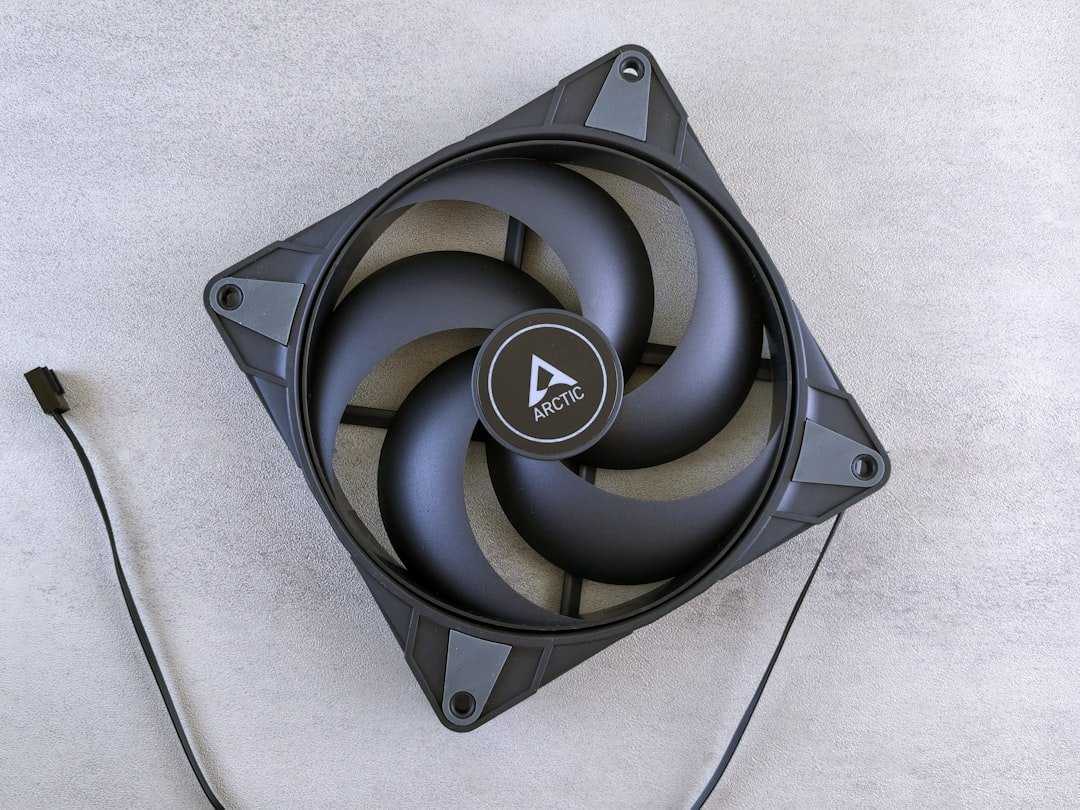 A computer fan is shown on a white surface.