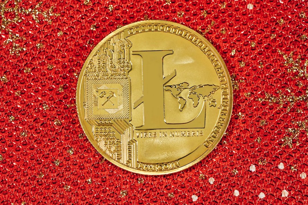 a gold coin sitting on top of a red cloth