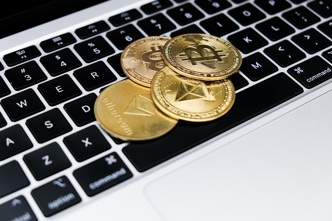 a group of gold coins on a keyboard