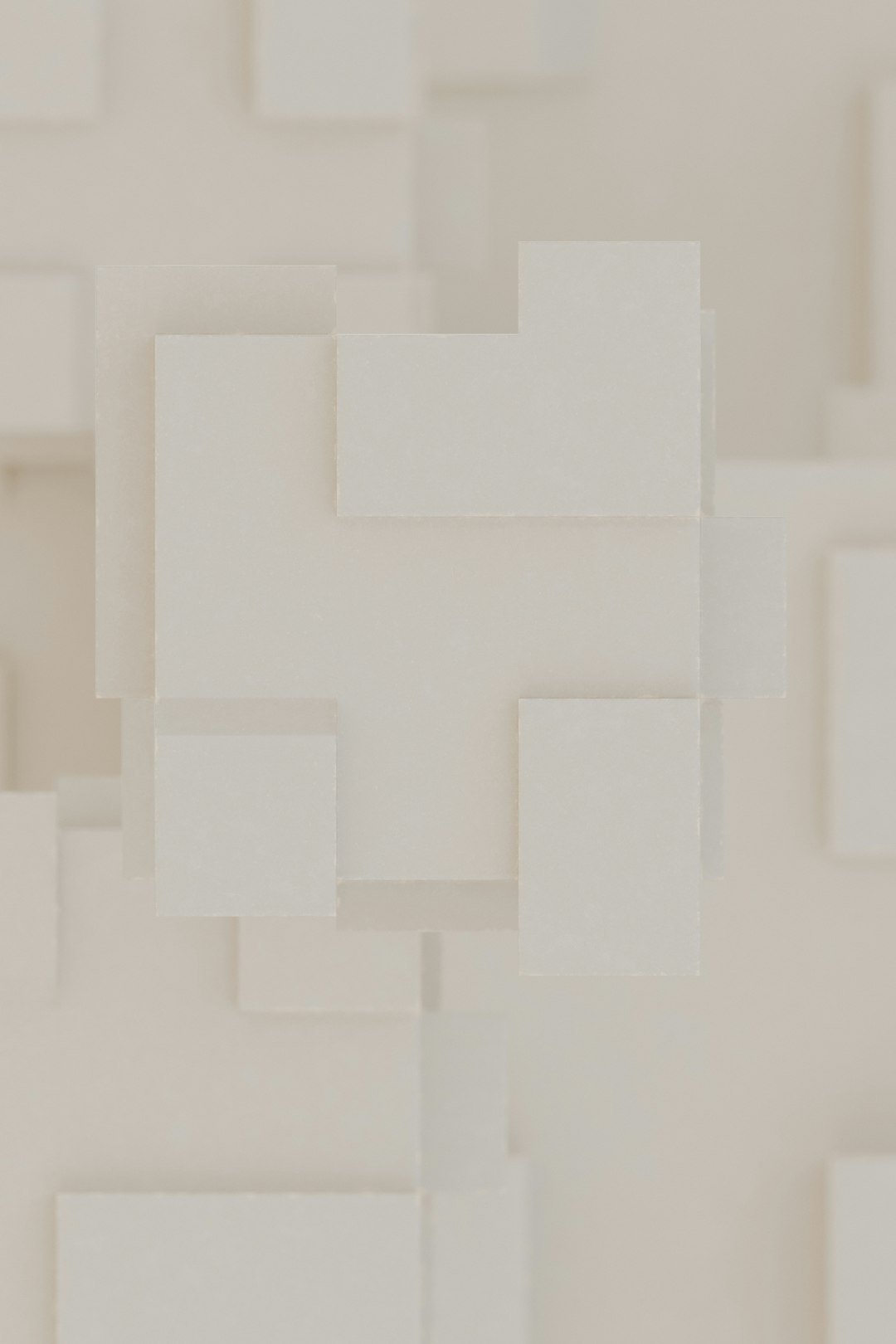 A white wall with a bunch of squares on it