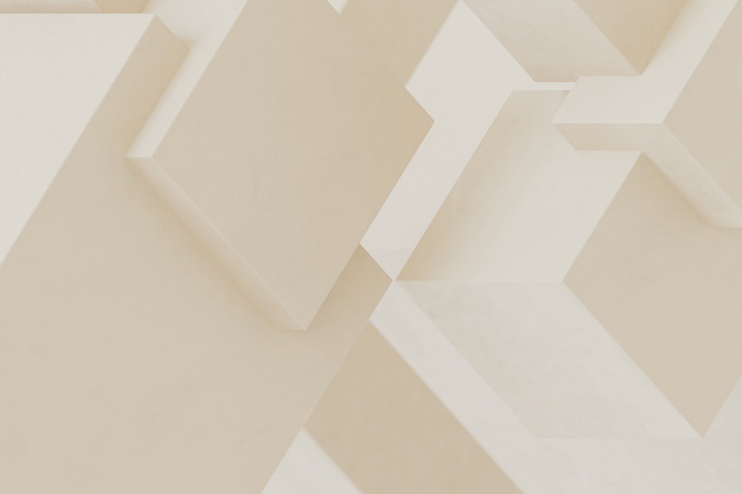 A close up of a white wall with a clock on it