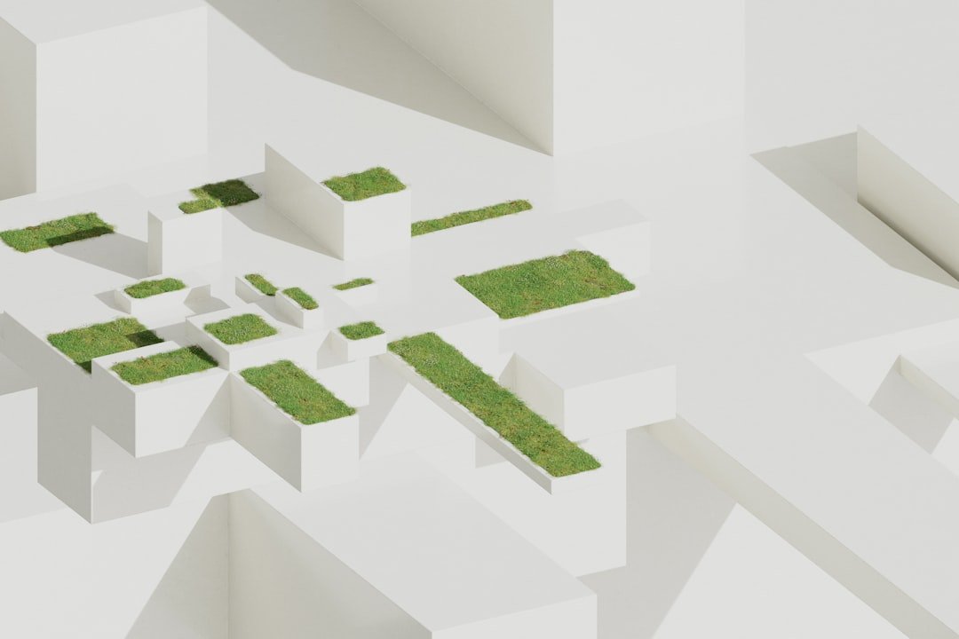 A group of white buildings with grass in the middle of them