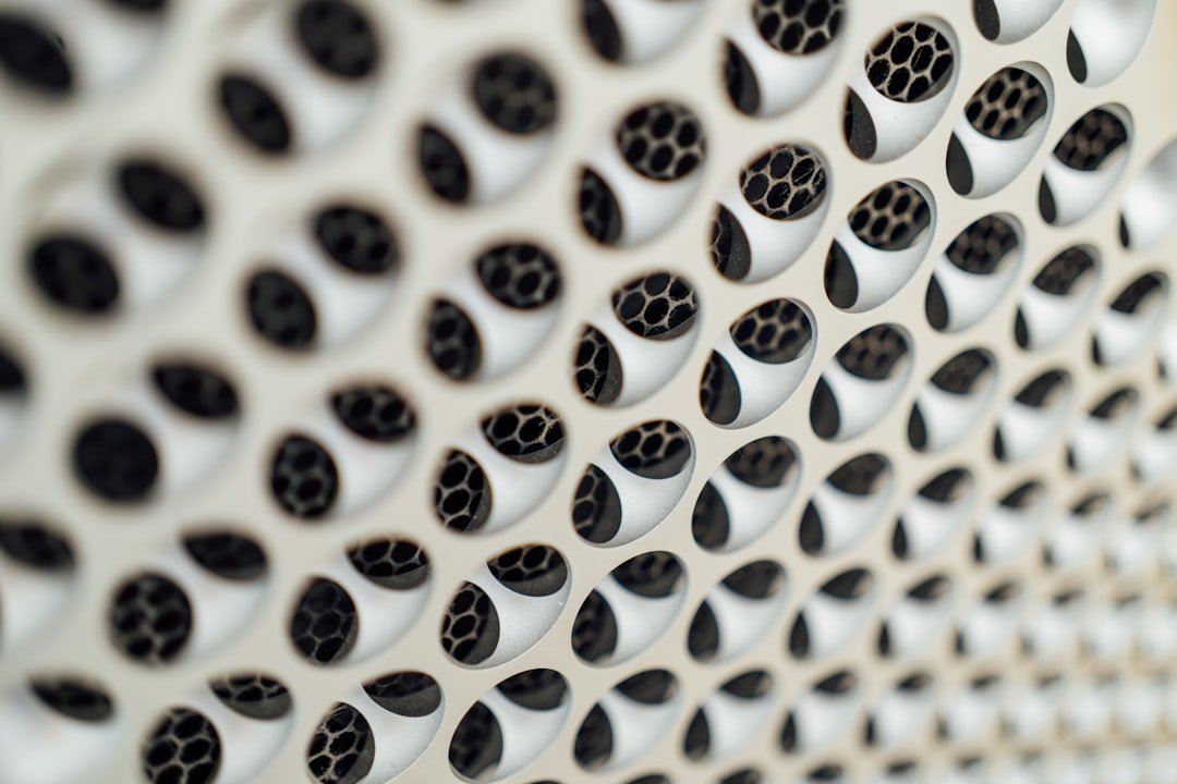 a close up of a wall with holes in it