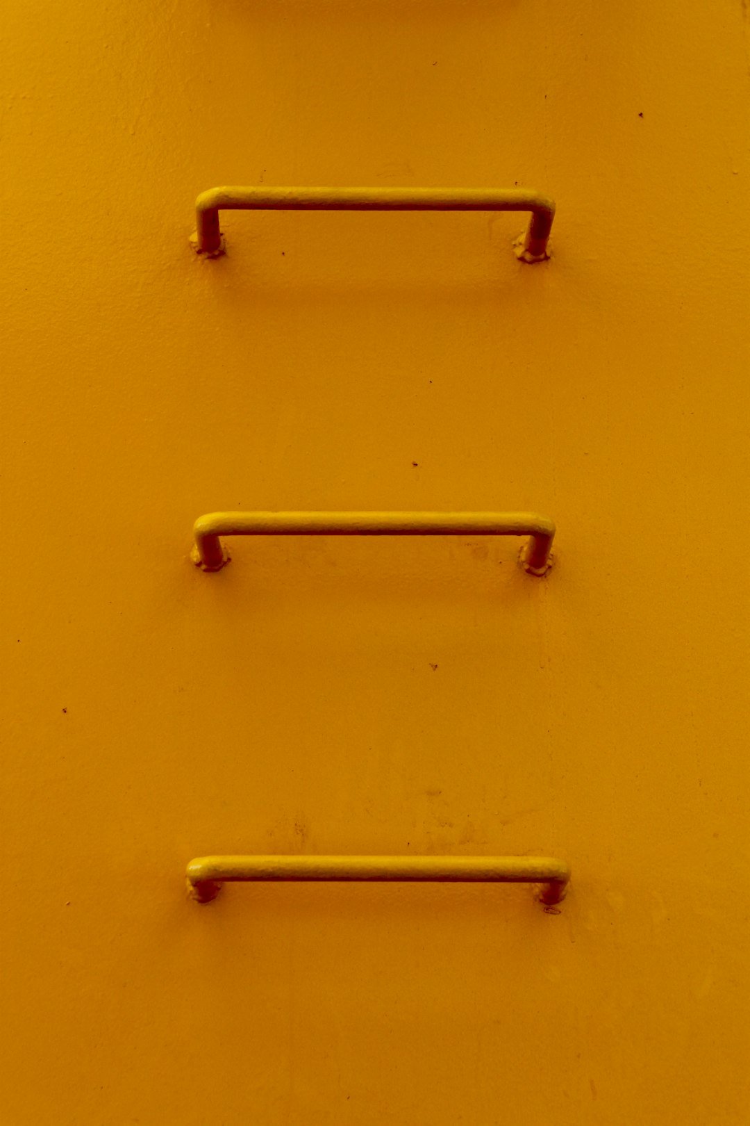 yellow metal wall mounted rack