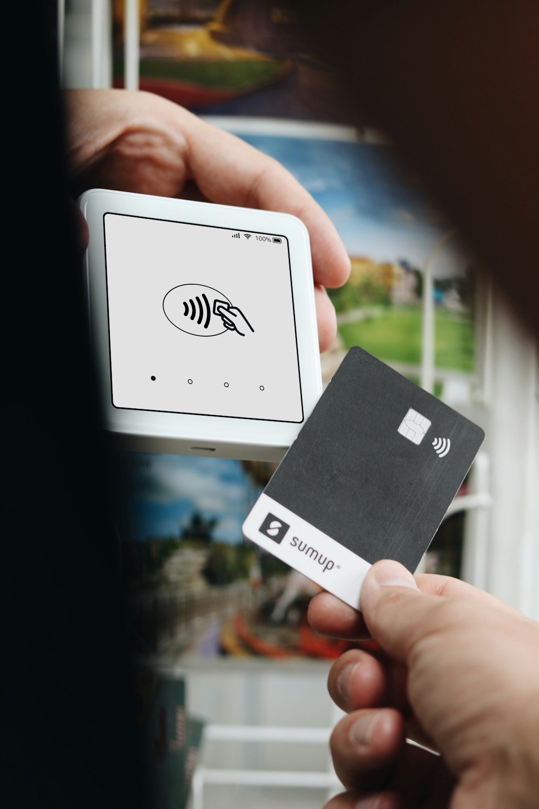 A person holding a card in their hand