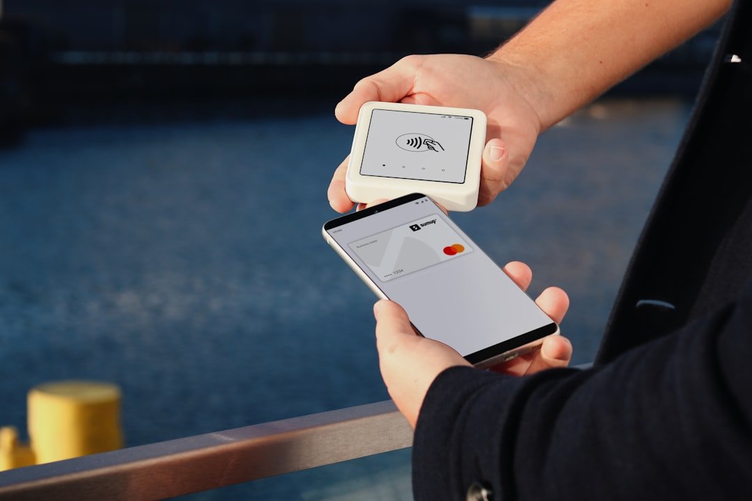 A person holding a smart phone in their hand