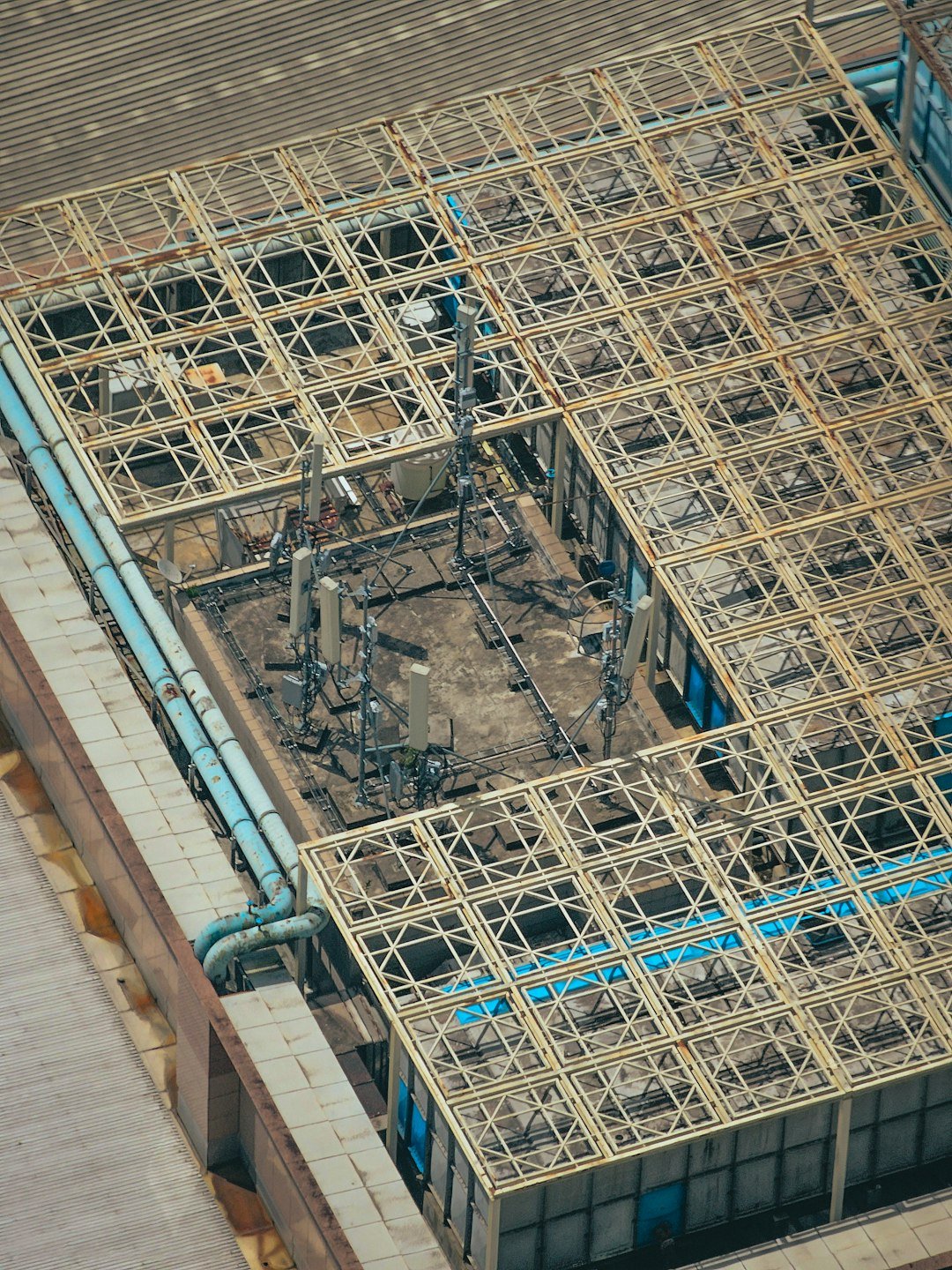 Antenna towers and grid-like building roof.