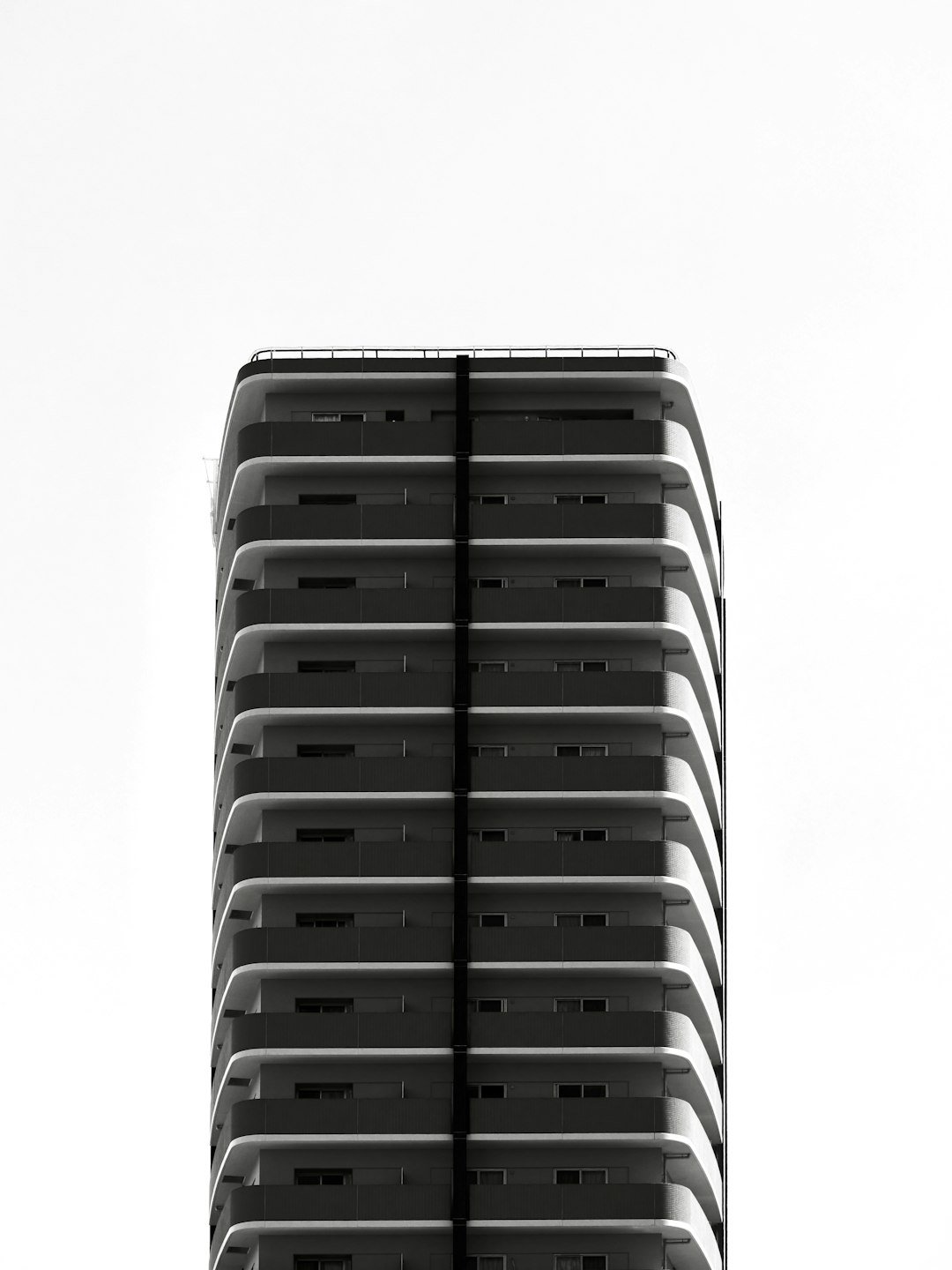 Modern skyscraper against a bright sky