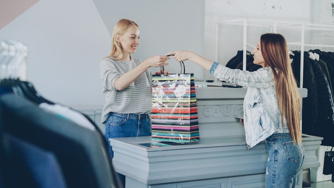 A customer receives a shopping bag at the store.