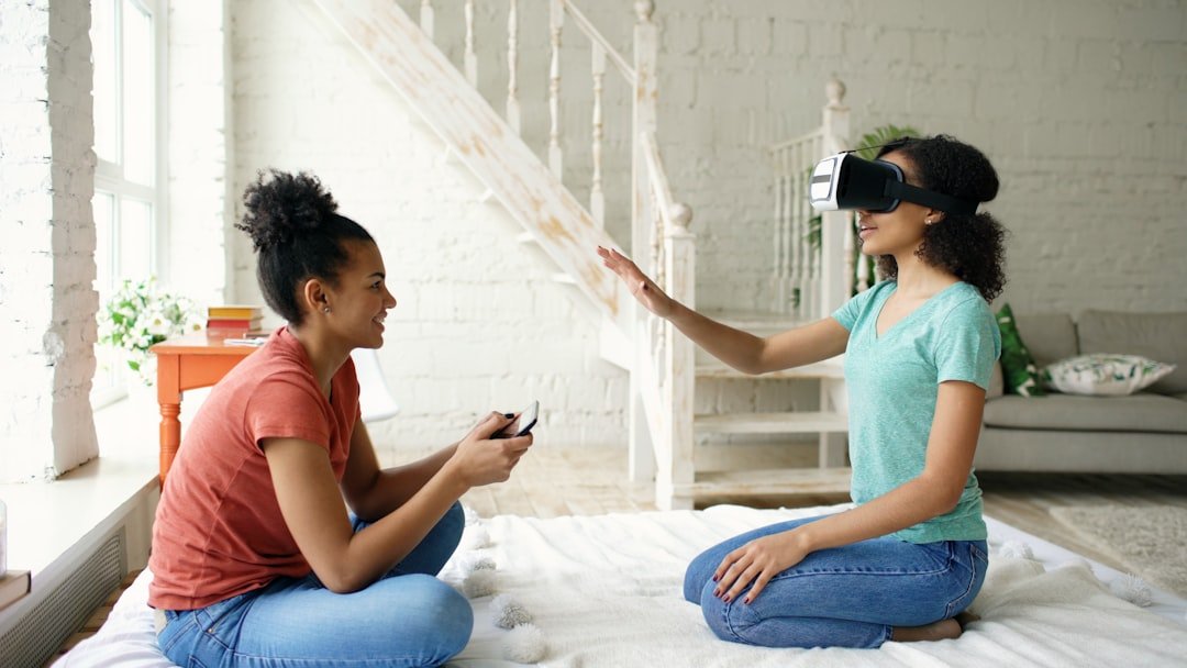 Two young women experiencing virtual reality together.