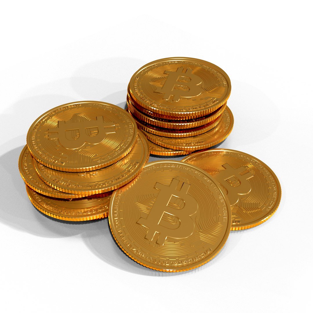 a pile of gold bitcoins sitting on top of each other